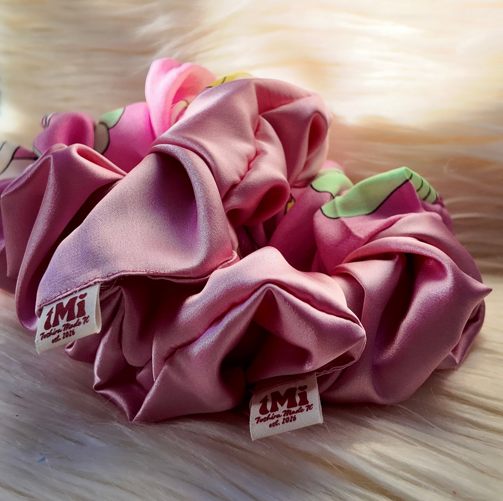 Pink scrunchie with green accents